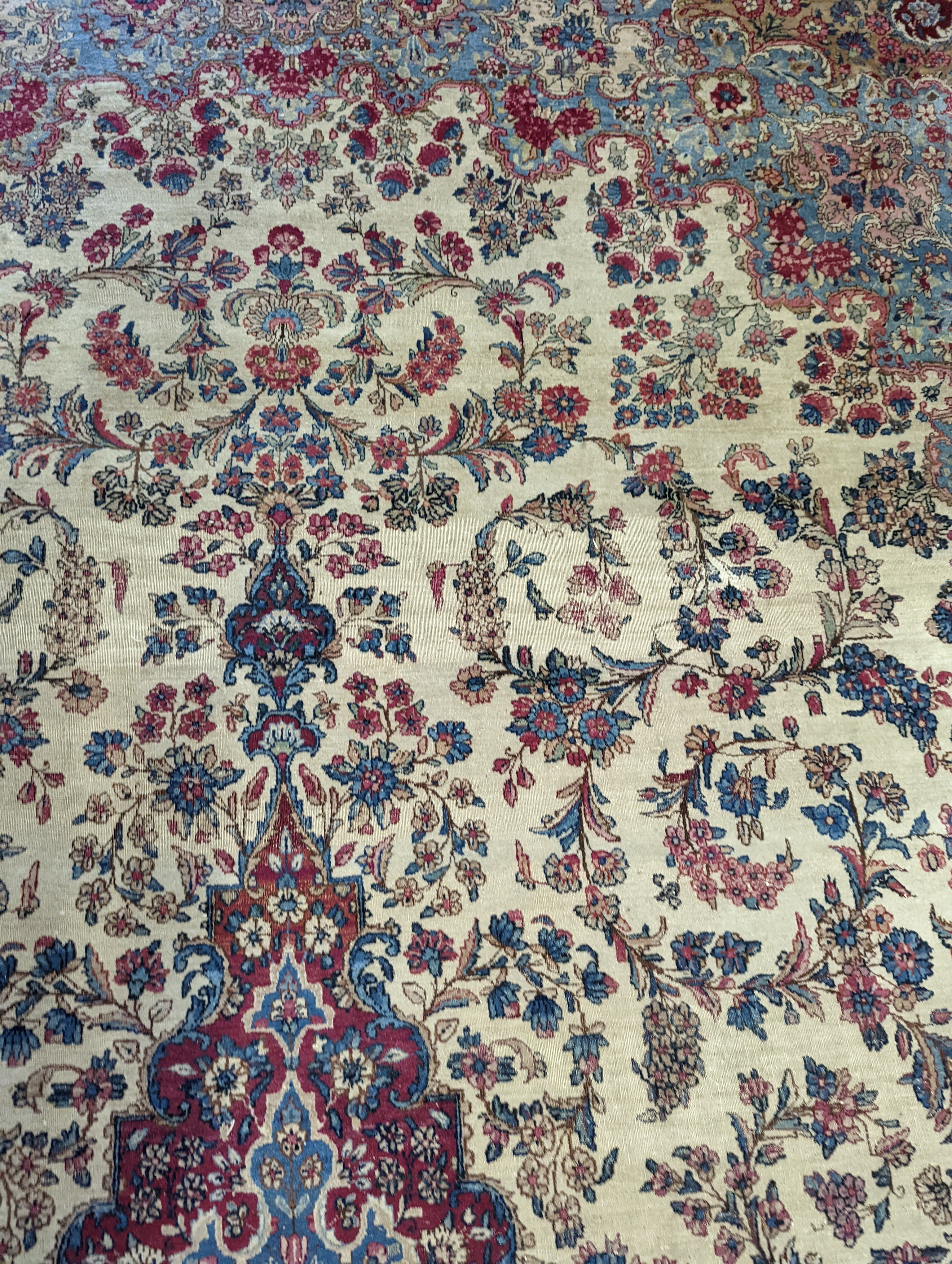 A North West Persian ivory ground carpet, 396 x 290cm